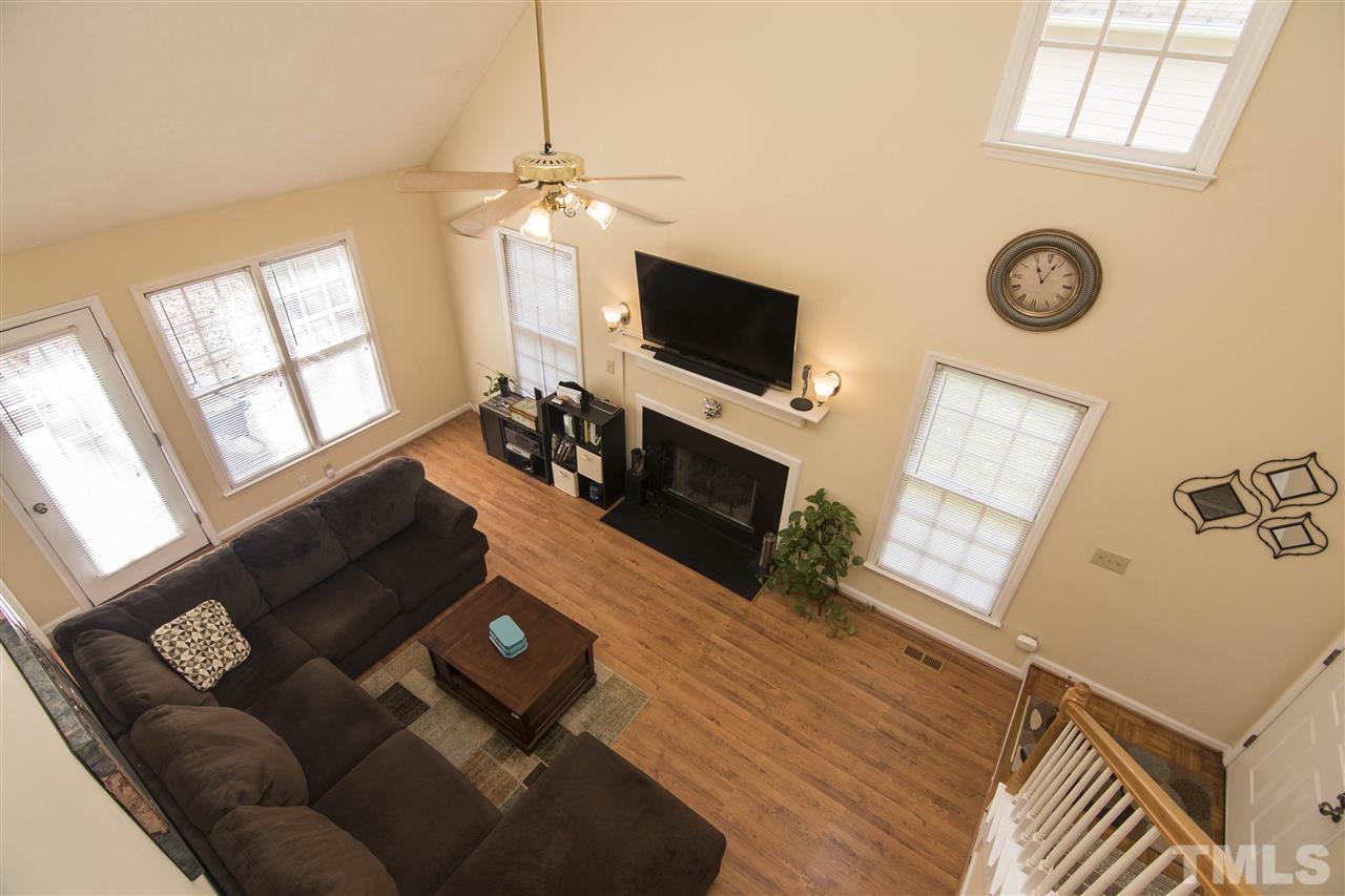 4416 Emmit Drive Raleigh, NC 27604 - Photo 8 of 28 a living room with furniture and a flat screen tv