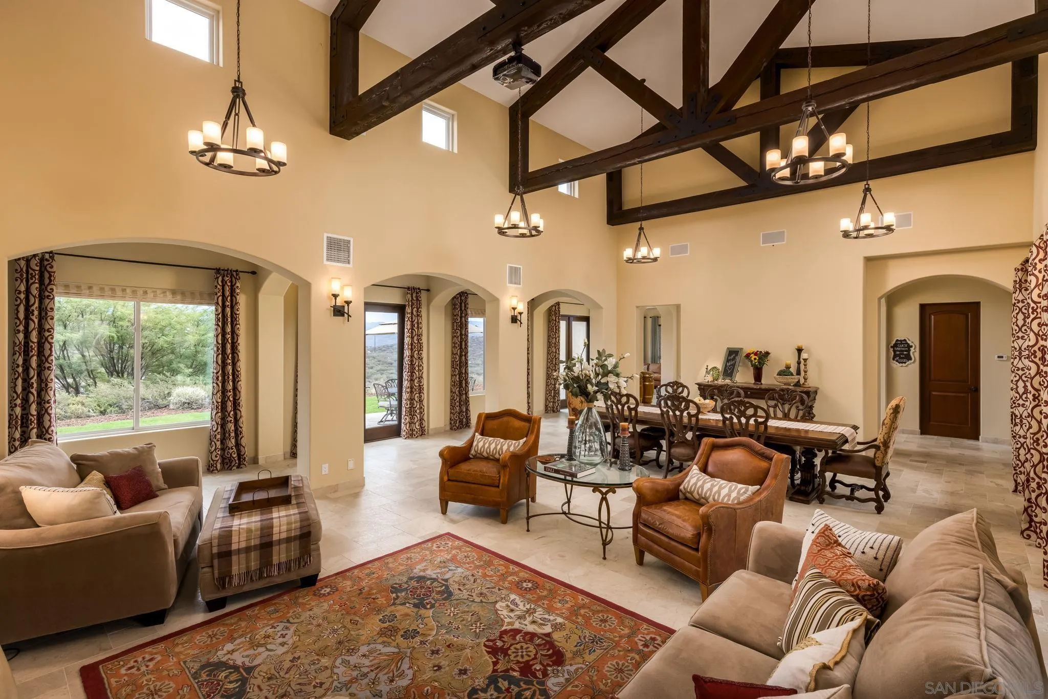 3132 Via Asoleado Alpine, CA 91901 - Photo 11 of 58 a living room with furniture a large window and a chandelier
