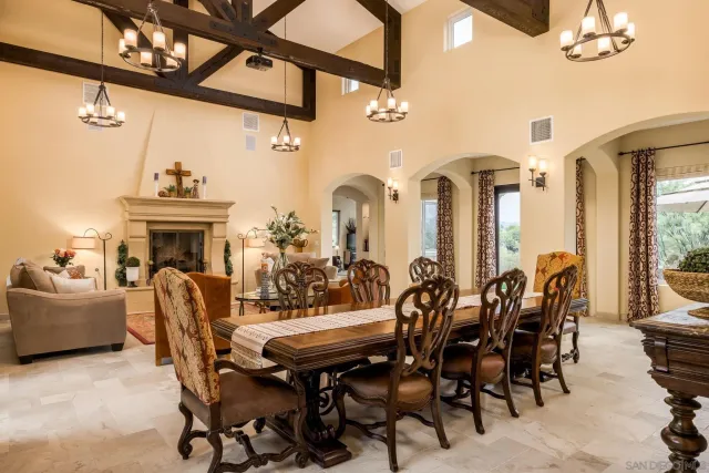 a kitchen with stainless steel appliances granite countertop a sink and a refrigerator