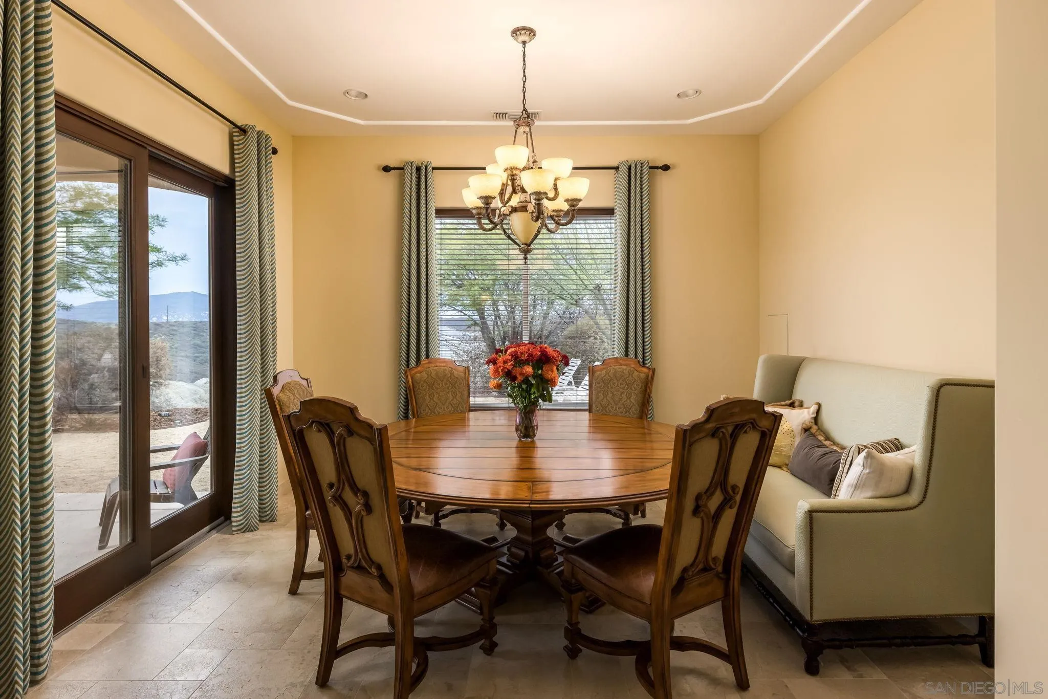 3132 Via Asoleado Alpine, CA 91901 - Photo 16 of 58 a dining room with furniture a chandelier and window