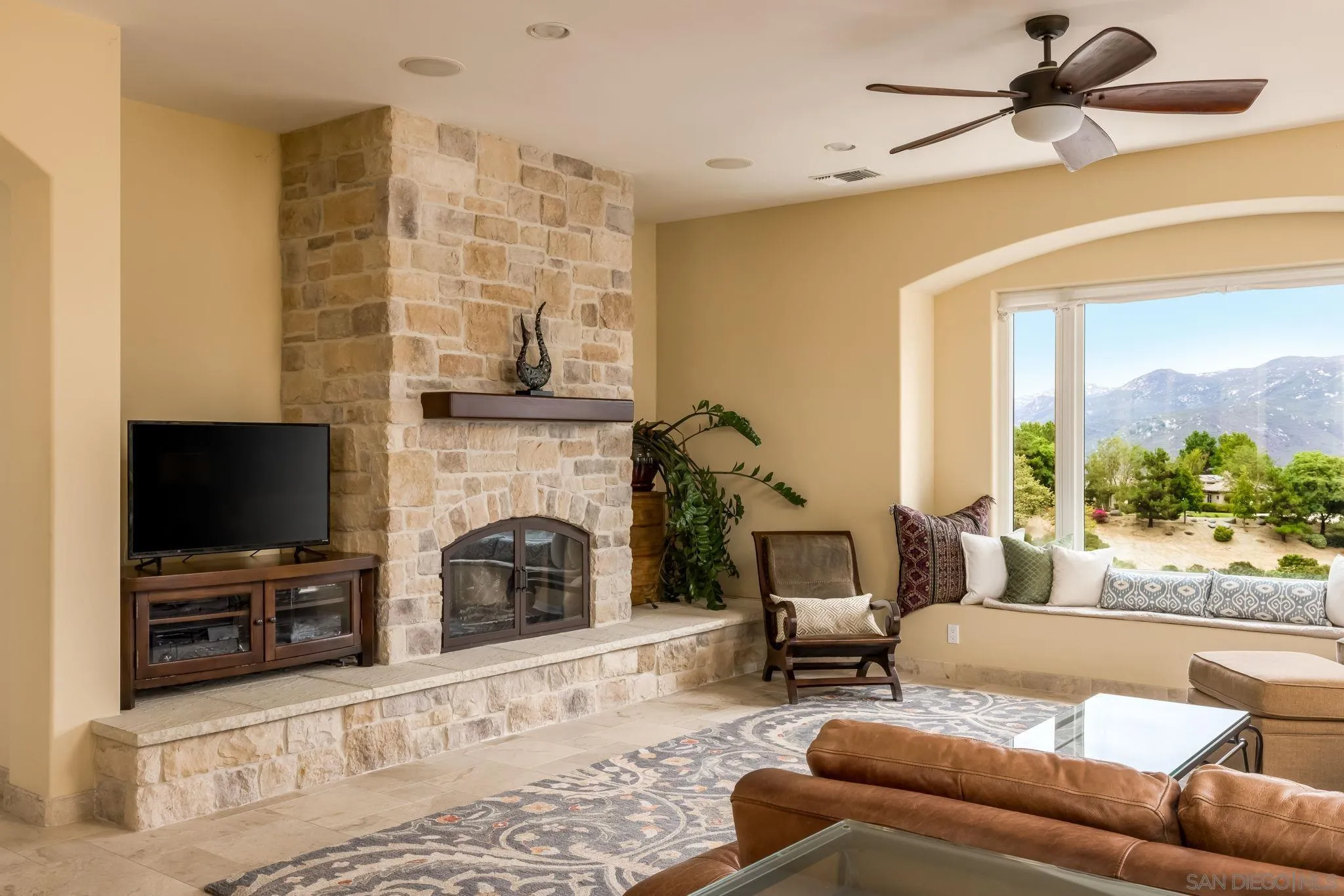 3132 Via Asoleado Alpine, CA 91901 - Photo 18 of 58 a living room with furniture a fireplace and a flat screen tv