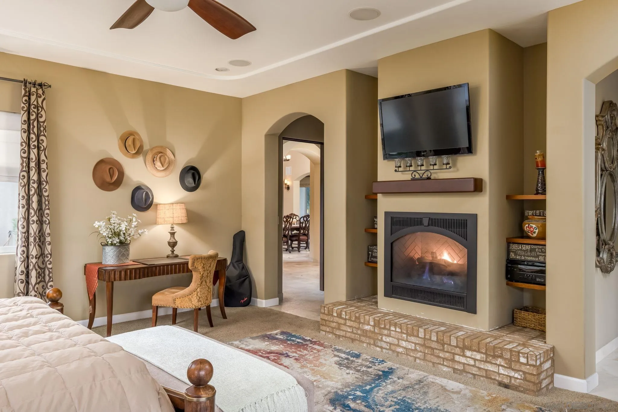 3132 Via Asoleado Alpine, CA 91901 - Photo 22 of 58 a bedroom with a bed and a fireplace