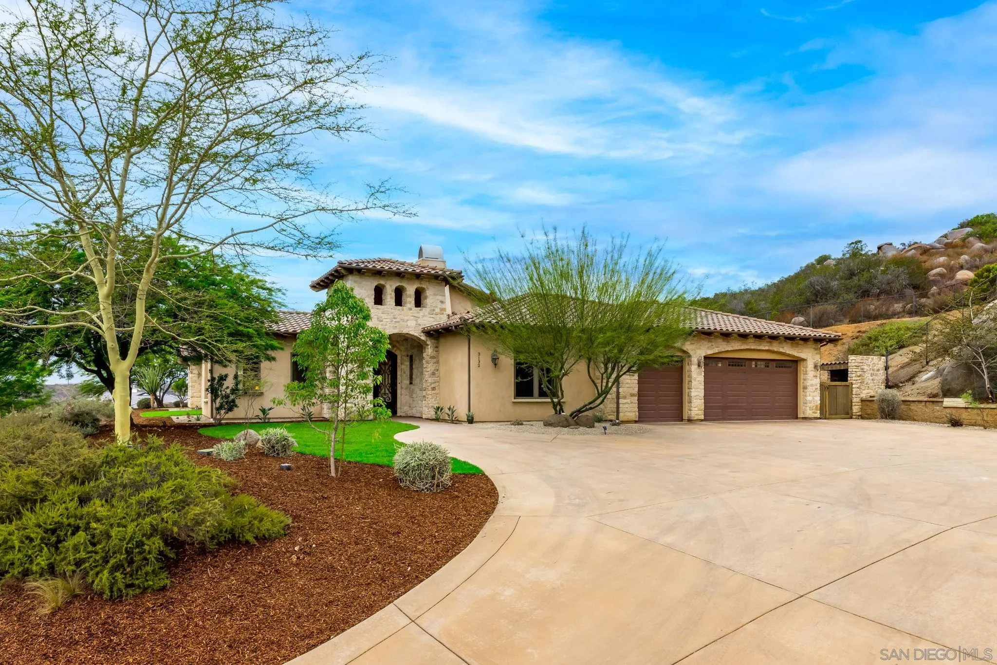 3132 Via Asoleado Alpine, CA 91901 - Photo 34 of 58 a front view of a house with a yard and trees