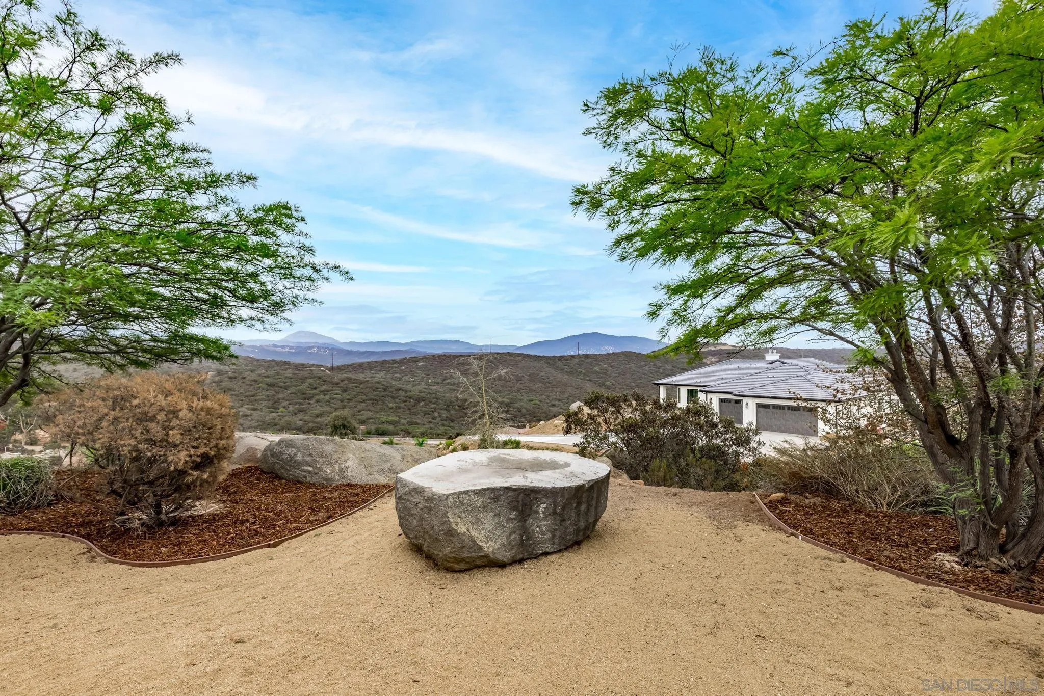 3132 Via Asoleado Alpine, CA 91901 - Photo 35 of 58 a view of a terrace with a bench and trees