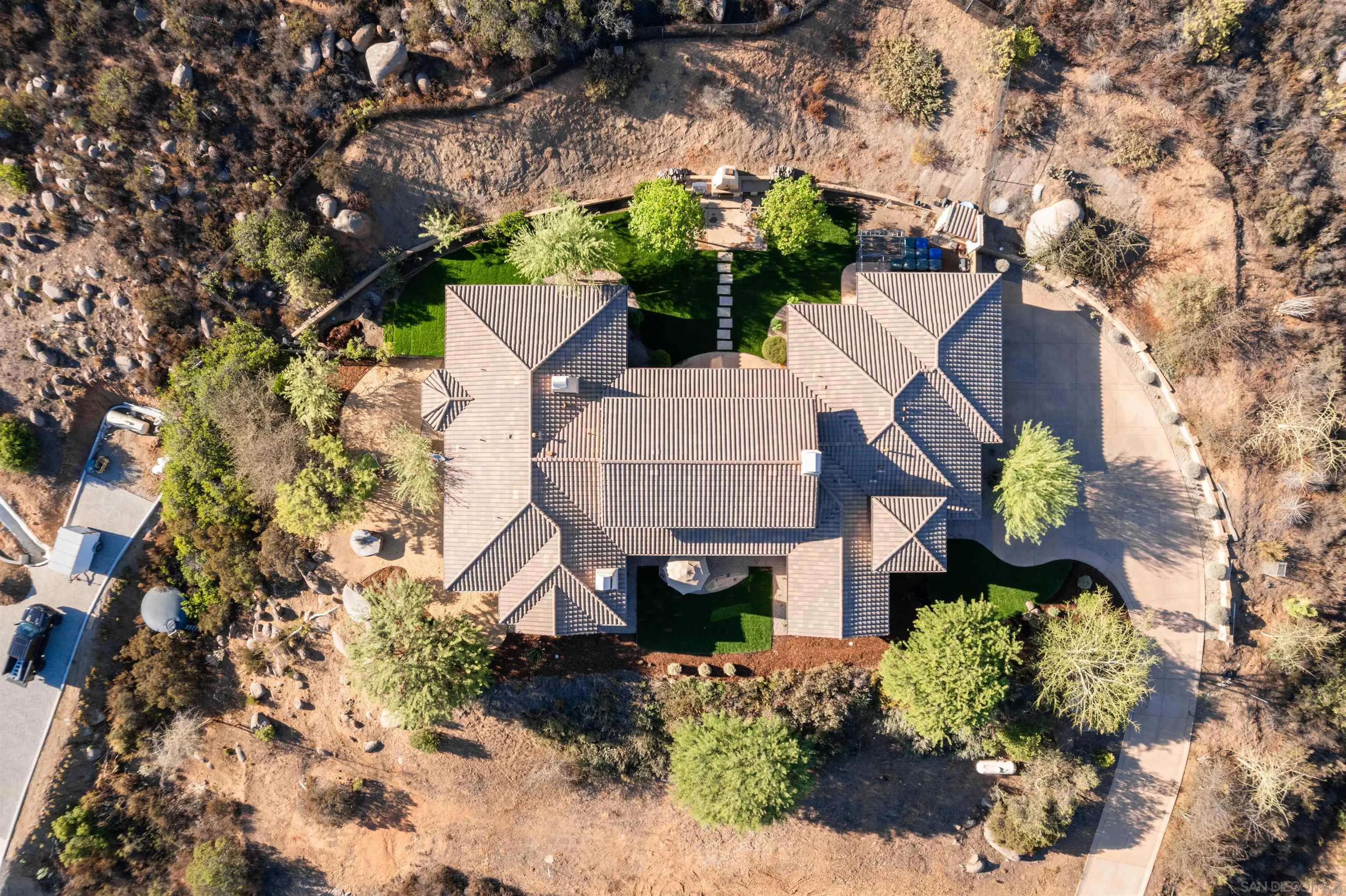 3132 Via Asoleado Alpine, CA 91901 - Photo 36 of 58 an aerial view of a house with a yard and large trees