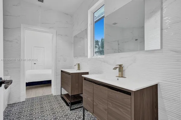 a bedroom with furniture and a ceiling fan