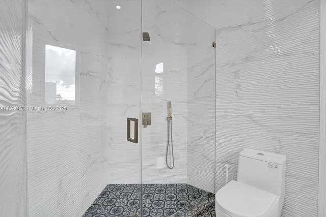 a bedroom with two beds and a table