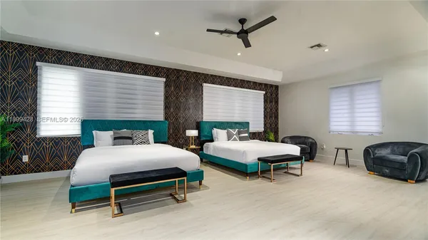 a bedroom with furniture and a window