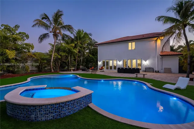 a view of swimming pool with outdoor seating
