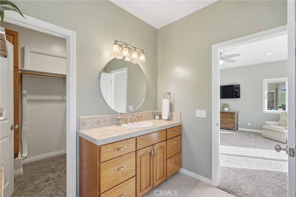 220 Cook Court Templeton, CA 93465 - Photo 24 of 45 a bathroom with a double vanity sink and a mirror