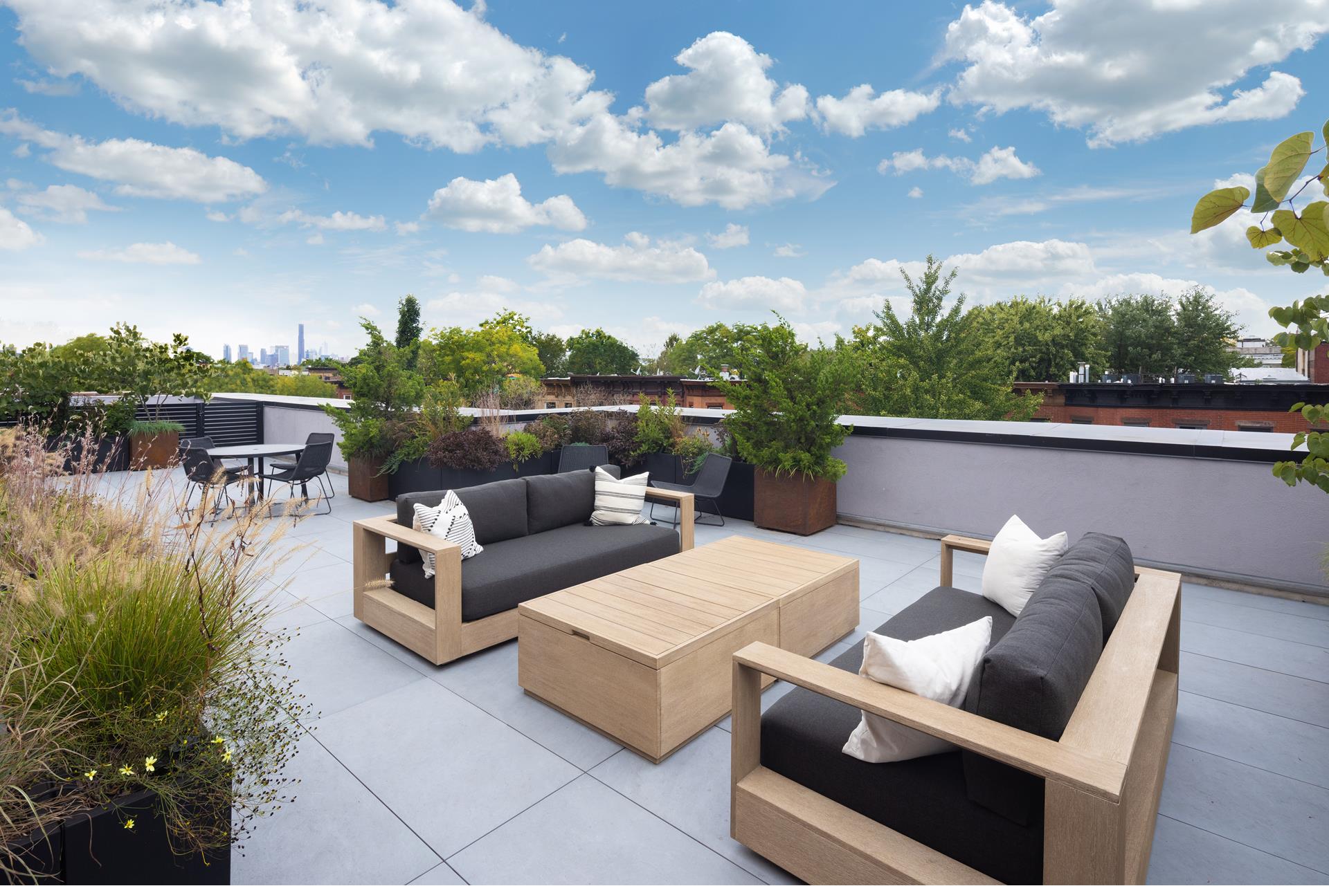 524 Halsey Street, Unit 105 Brooklyn, NY 11233 - Photo 10 of 15 a view of a terrace with couches and potted plants