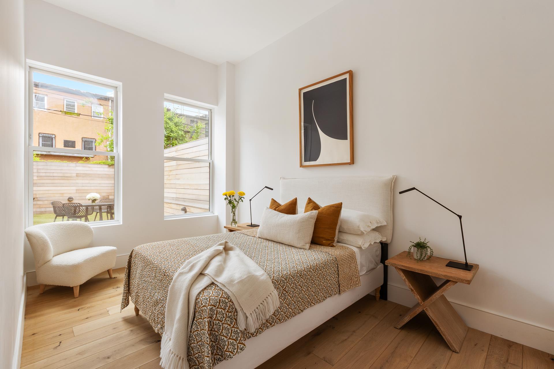 524 Halsey Street, Unit 105 Brooklyn, NY 11233 - Photo 5 of 15 a bedroom with a bed and wooden floor