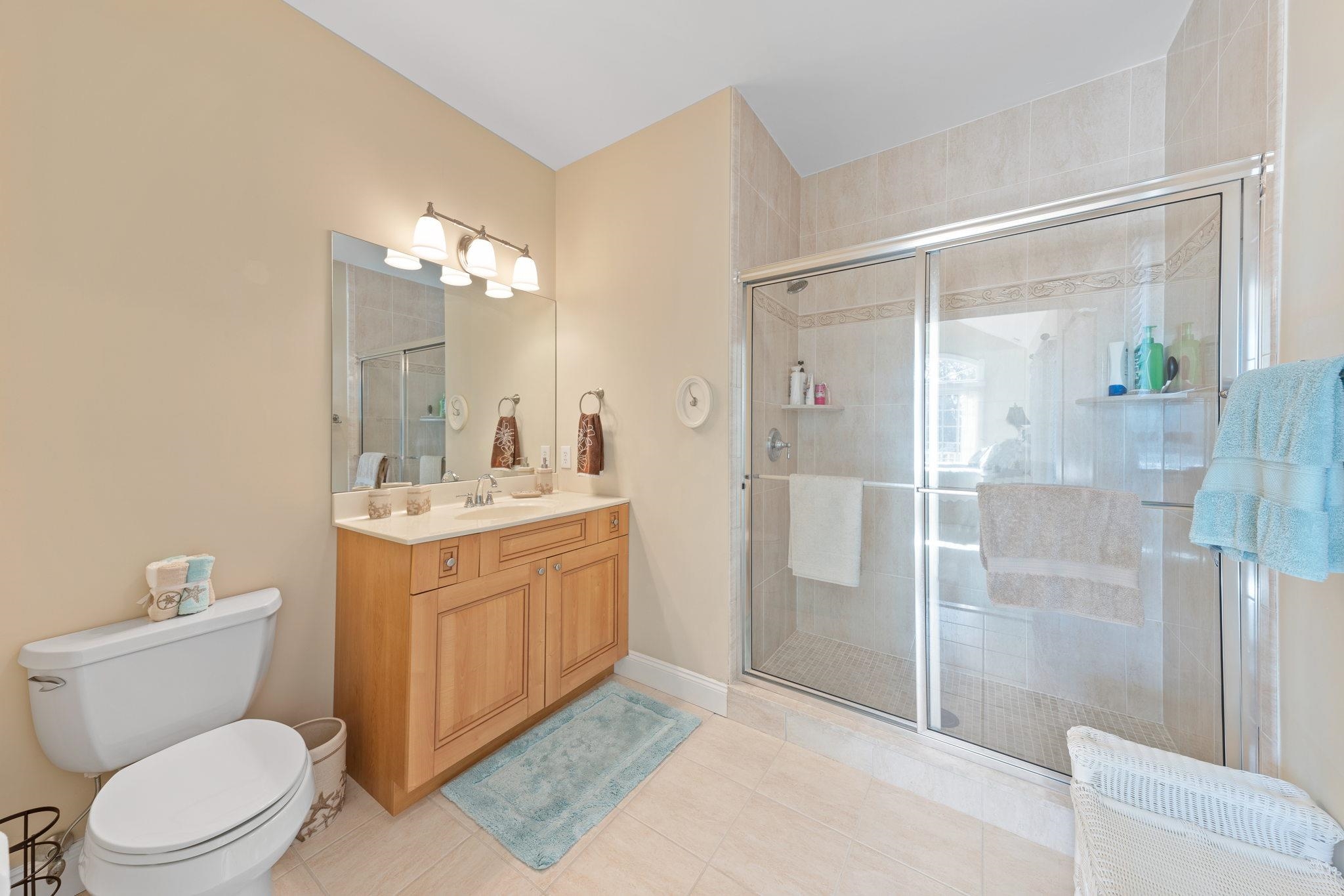 244 23rd Street Avalon, NJ 08202 - Photo 11 of 21 a bathroom with a toilet a sink and shower