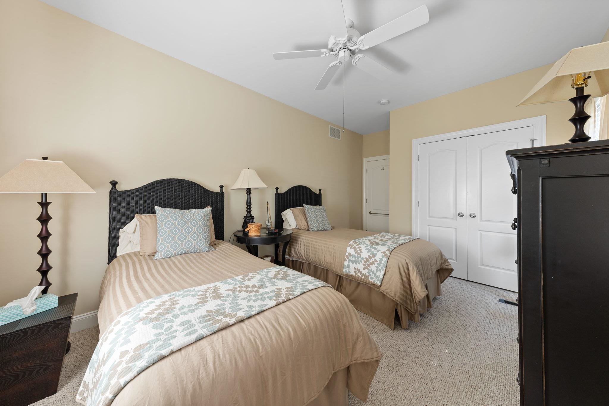 244 23rd Street Avalon, NJ 08202 - Photo 16 of 21 a bedroom with two beds and a chandelier
