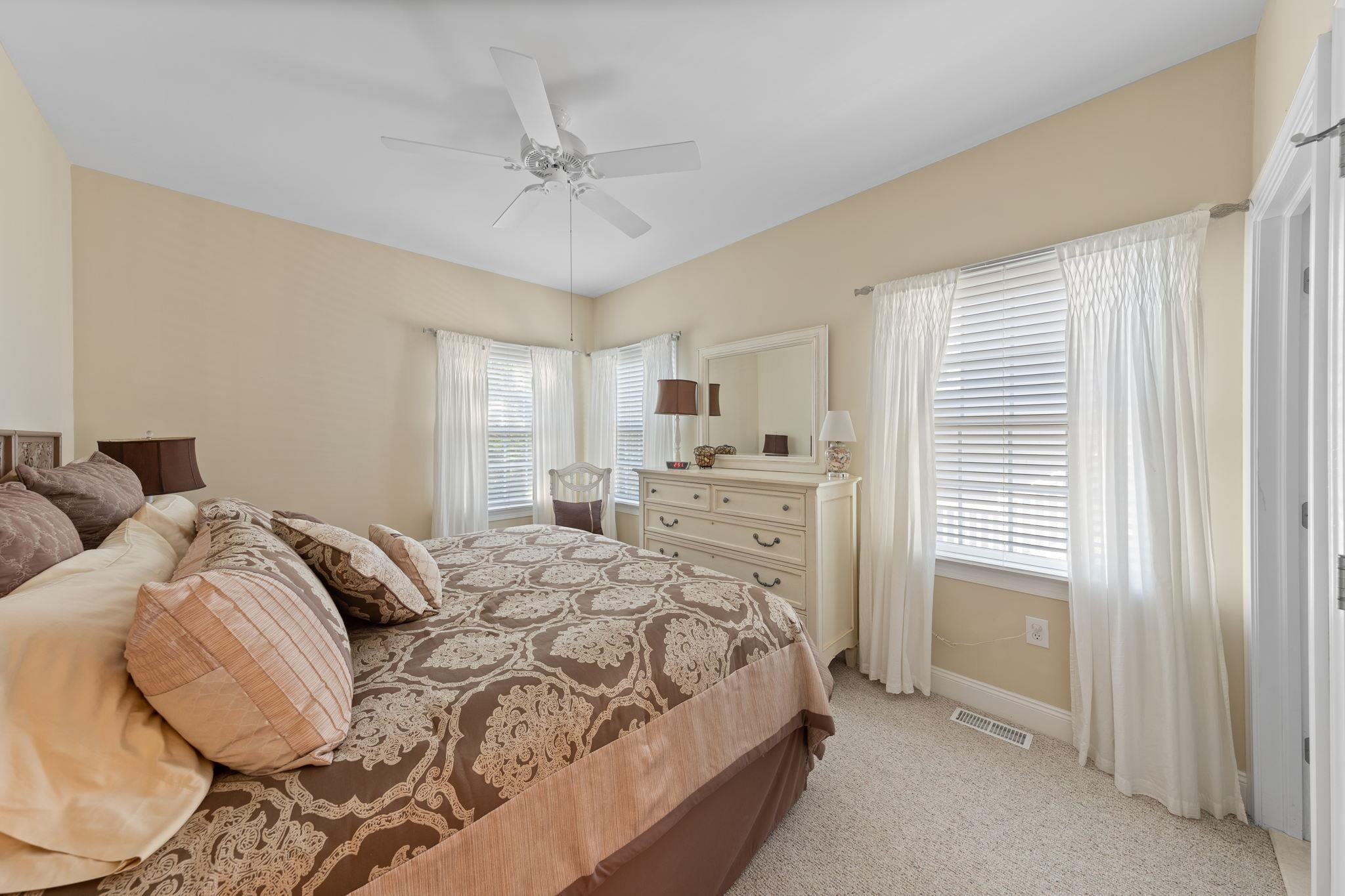 244 23rd Street Avalon, NJ 08202 - Photo 18 of 21 a bedroom with a bed and a window