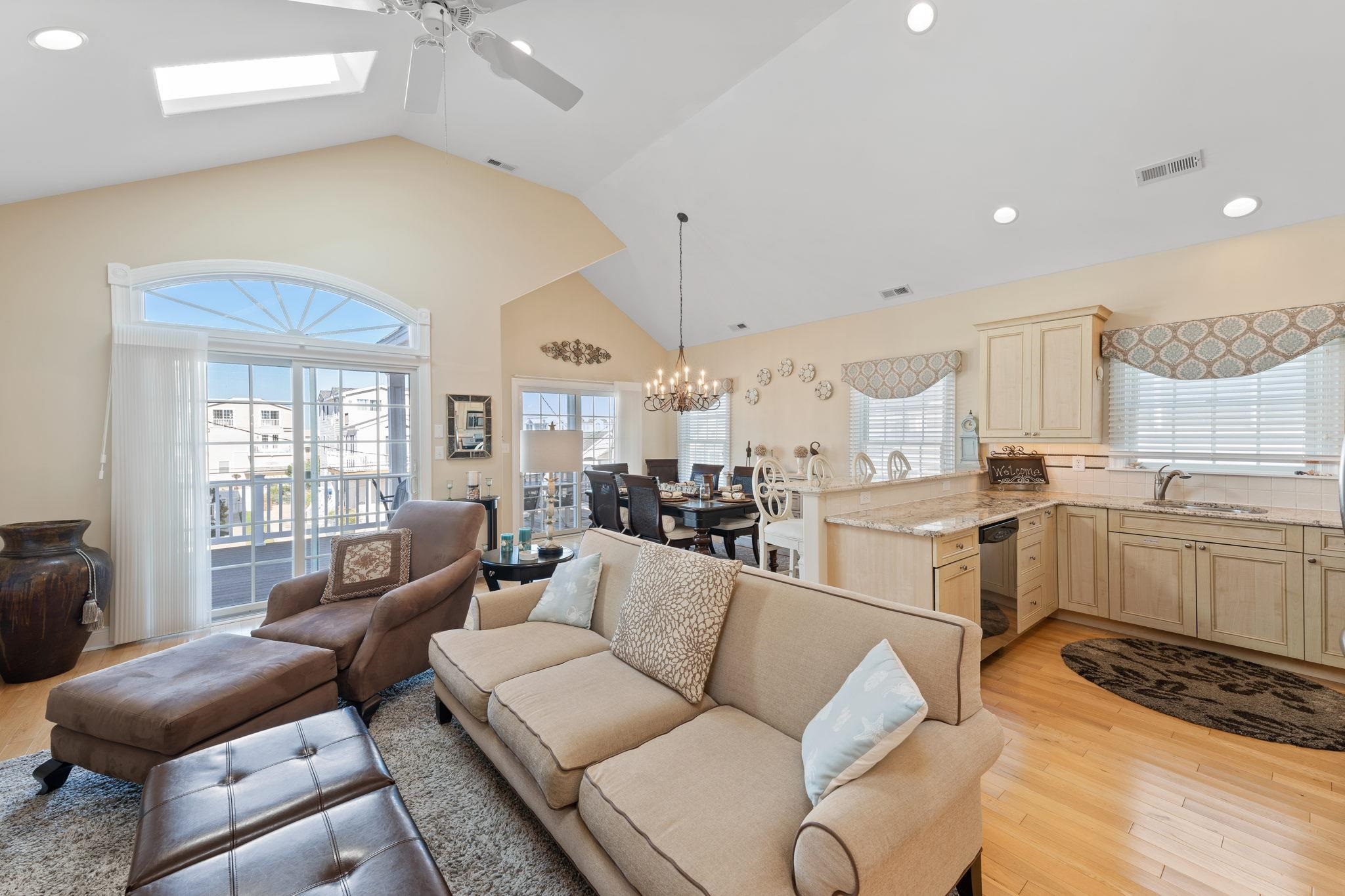 244 23rd Street Avalon, NJ 08202 - Photo 3 of 21 a living room with furniture and kitchen view