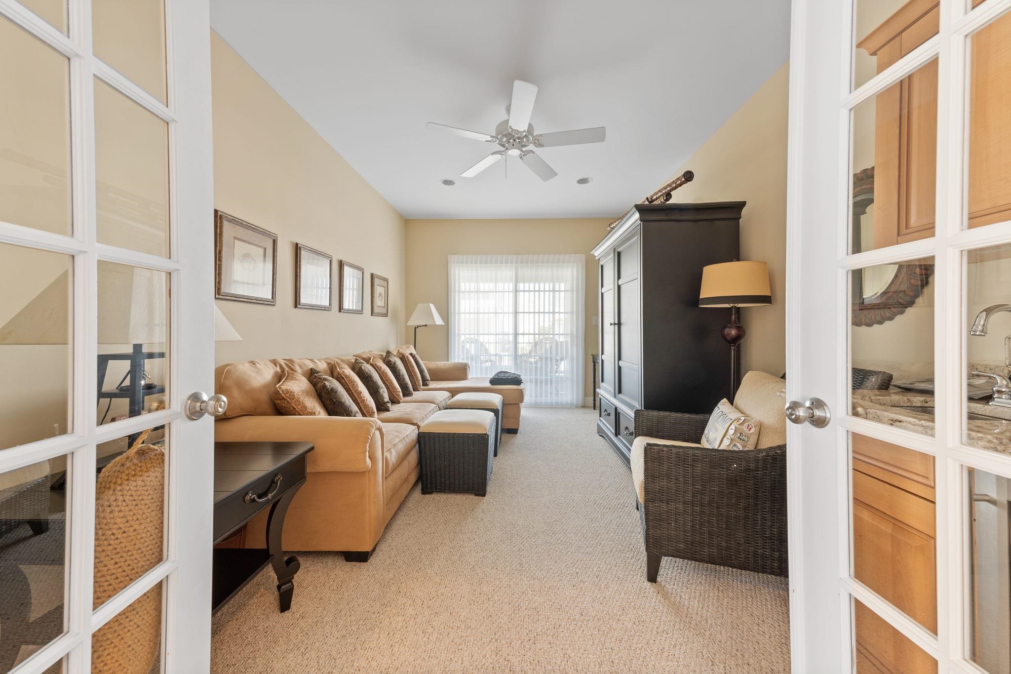 244 23rd Street Avalon, NJ 08202 - Photo 9 of 21 a living room with furniture and a large window