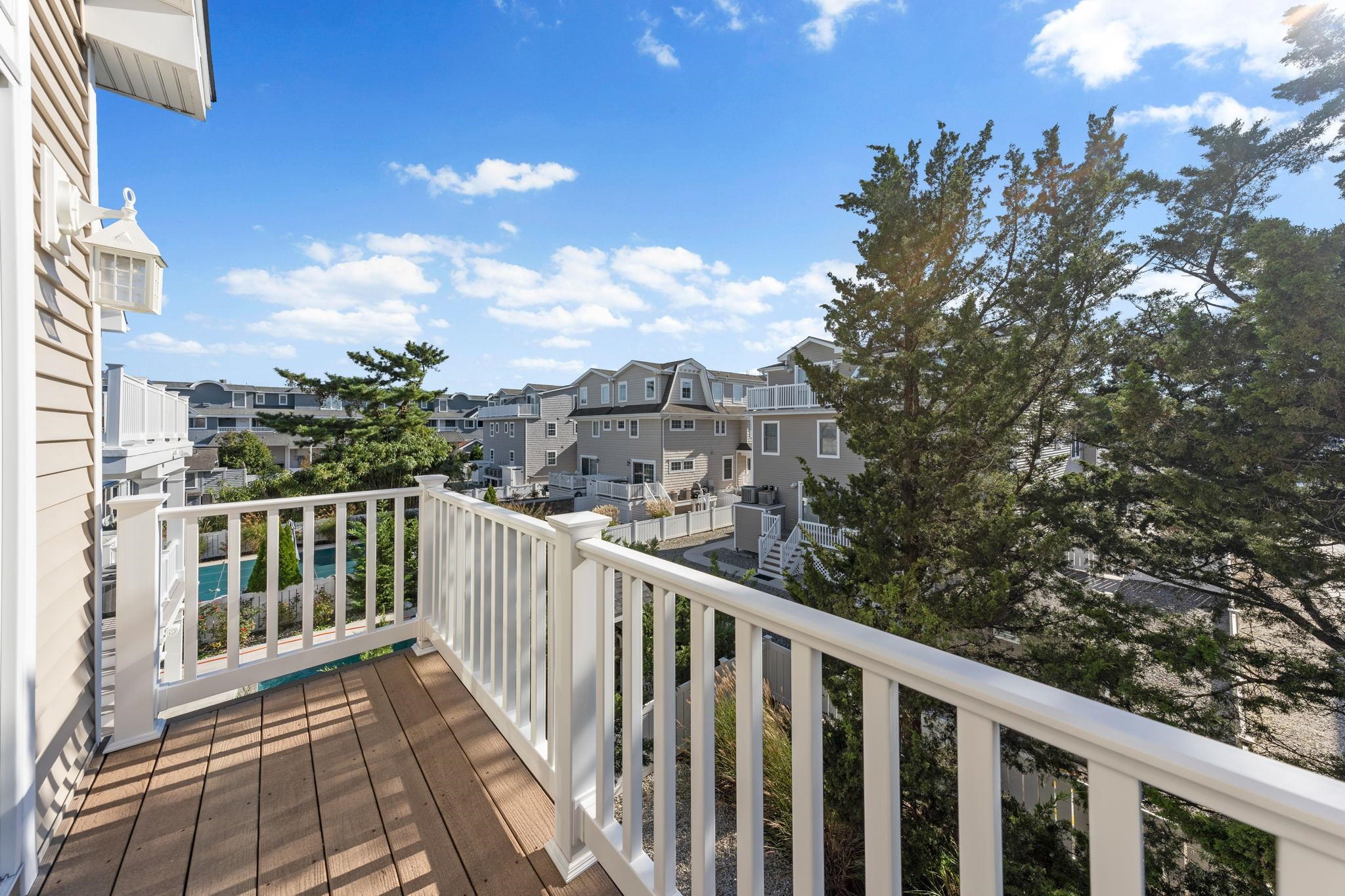 244 23rd Street Avalon, NJ 08202 - Photo 10 of 21 a view of a balcony with wooden fence and floor