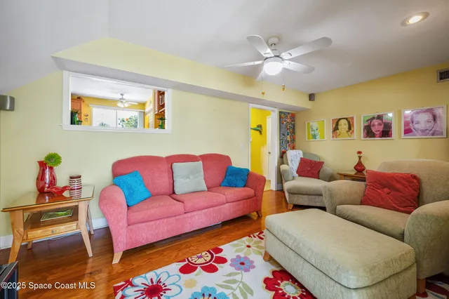 a living room with furniture and a rug