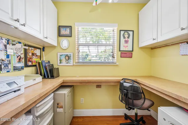 a view of a kitchen with furniture and windows