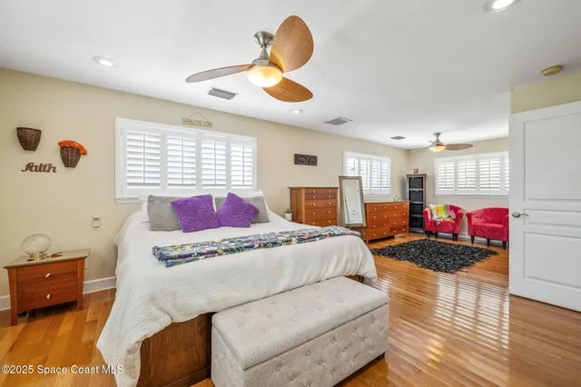 a bed room with a bed and a window