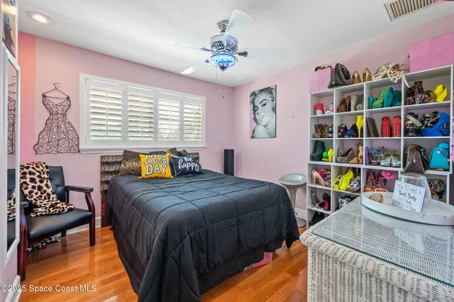a bed room with a bed and a chandelier