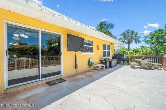 a view of balcony with wooden floor and seating space