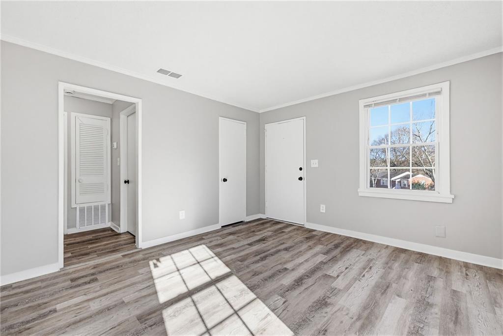 1789 Cahoon Street Southwest Atlanta, GA 30310 - Photo 7 of 12 a view of empty room with wooden floor