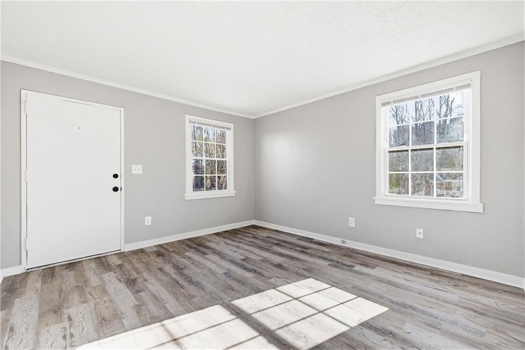 1789 Cahoon Street Southwest Atlanta, GA 30310 - Photo 8 of 15 an empty room with windows