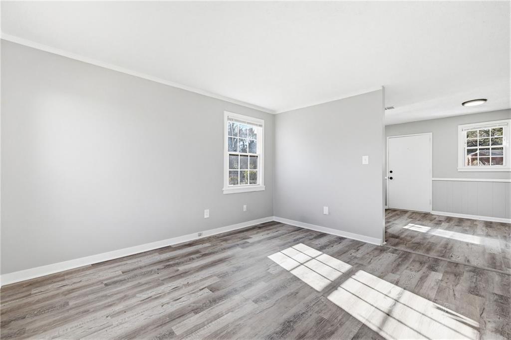 1789 Cahoon Street Southwest Atlanta, GA 30310 - Photo 8 of 16 a view of empty room with wooden floor and fan