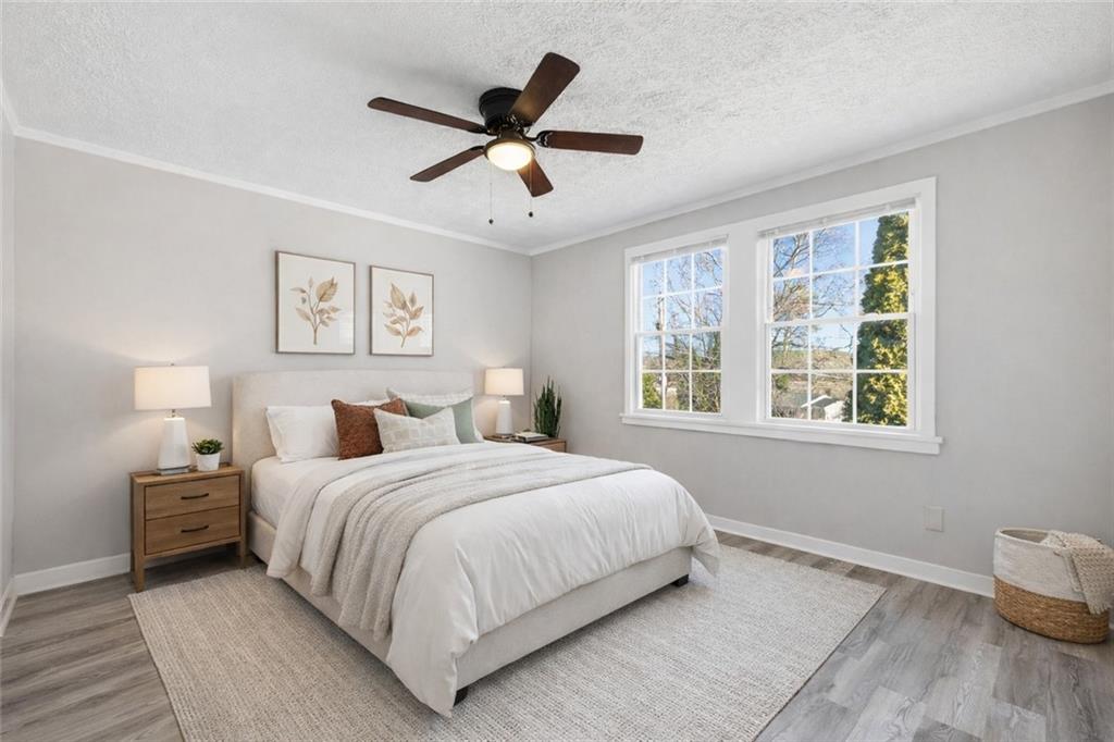 1789 Cahoon Street Southwest Atlanta, GA 30310 - Photo 10 of 15 a bedroom with a large bed and a window