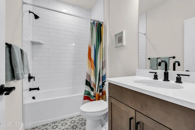 a bathroom with a double vanity sink and mirror