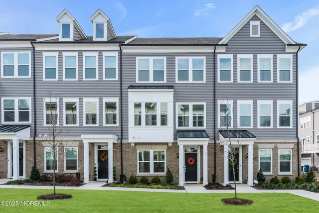 an aerial view of houses with yard