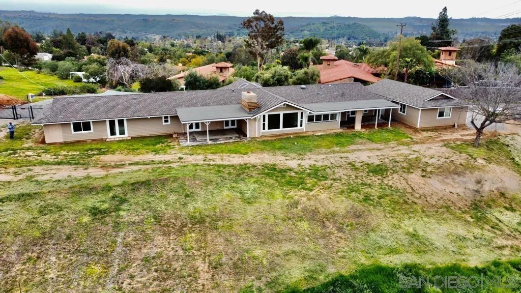 13822 Northcrest Lane Poway, CA 92064 - Photo 2 of 26 an aerial view of residential houses with outdoor space and trees