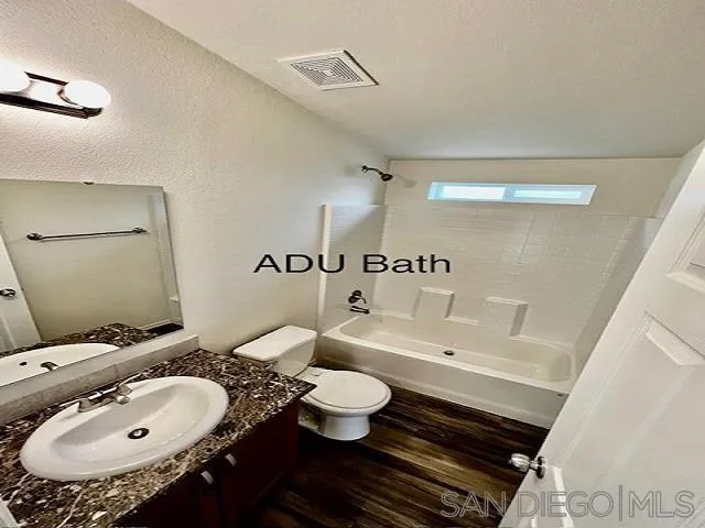 13822 Northcrest Lane Poway, CA 92064 - Photo 22 of 26 a bathroom with a sink and mirror with toilet