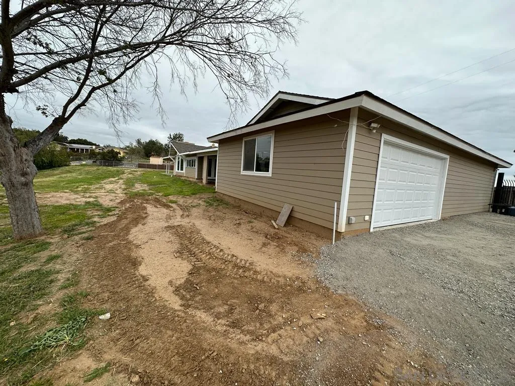 13822 Northcrest Lane Poway, CA 92064 - Photo 24 of 26 a view of backyard of house and car parked