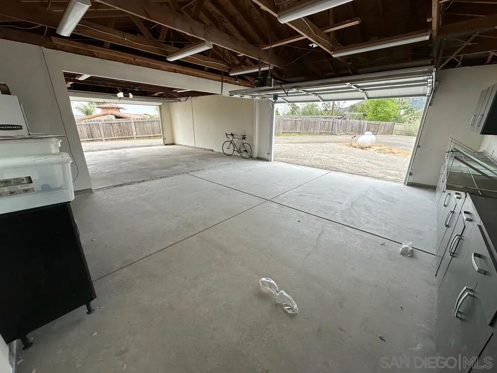 13822 Northcrest Lane Poway, CA 92064 - Photo 26 of 26 a view of empty room with wooden floor and windows