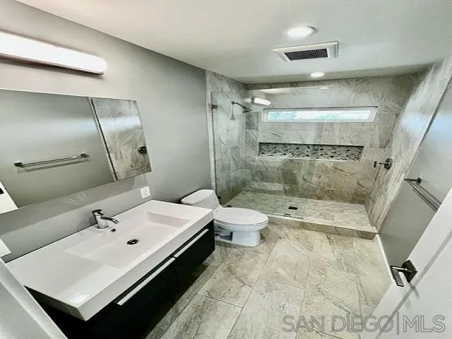 13822 Northcrest Lane Poway, CA 92064 - Photo 10 of 26 a bathroom with a sink a toilet and shower