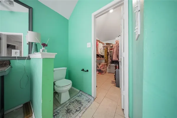 a bathroom with a toilet and a sink