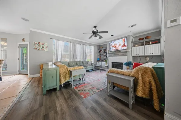 a living room with furniture and a fireplace