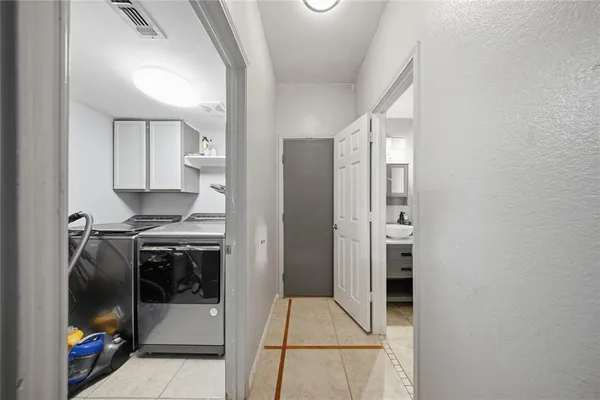 a kitchen with stainless steel appliances granite countertop a stove and a refrigerator