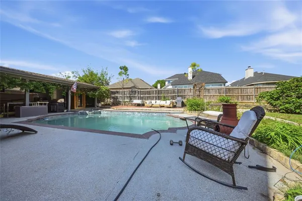 a view of a patio in backyard