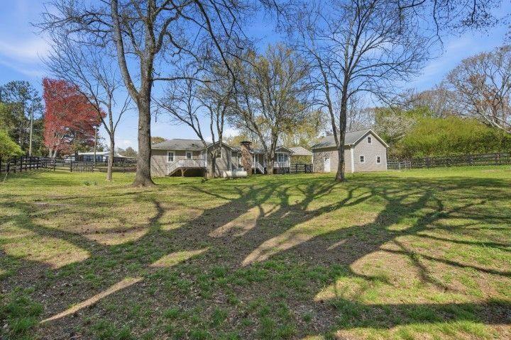 2215 Roper Road Cumming, GA 30028 - Photo 13 of 24 a view of a park with large trees