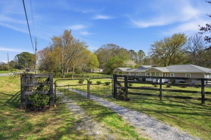 2215 Roper Road Cumming, GA 30028 - Photo 16 of 24 a view of a swimming pool with a patio