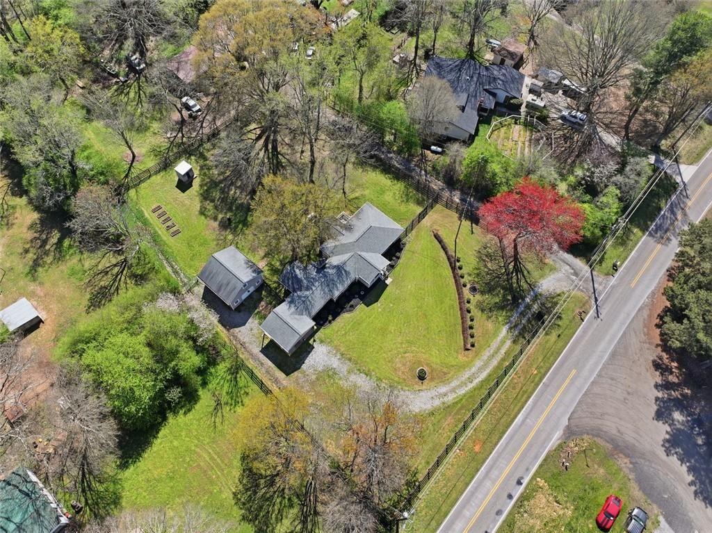 2215 Roper Road Cumming, GA 30028 - Photo 20 of 24 an aerial view of a house with swimming pool and outdoor seating