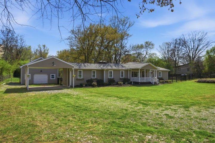 2215 Roper Road Cumming, GA 30028 - Photo 4 of 24 a front view of a house with yard and green space
