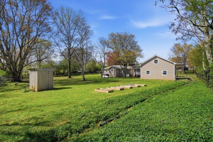 2215 Roper Road Cumming, GA 30028 - Photo 8 of 24 a view of a house with a big yard