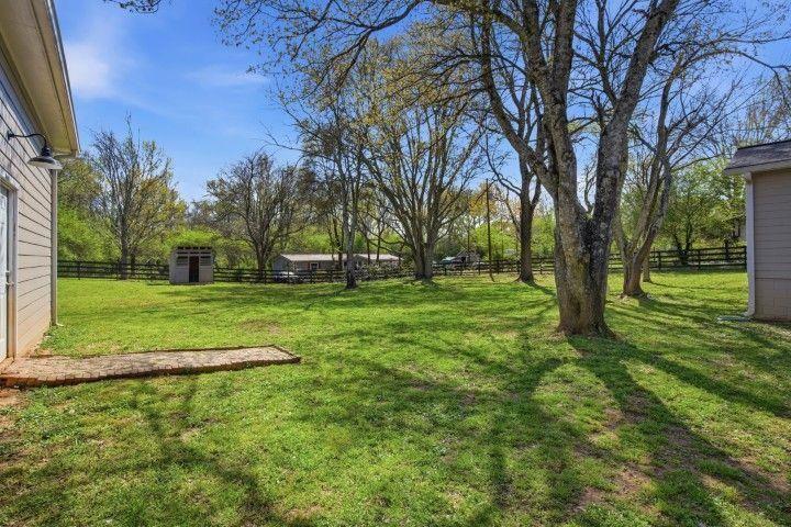 2215 Roper Road Cumming, GA 30028 - Photo 10 of 24 a view of a park with large trees