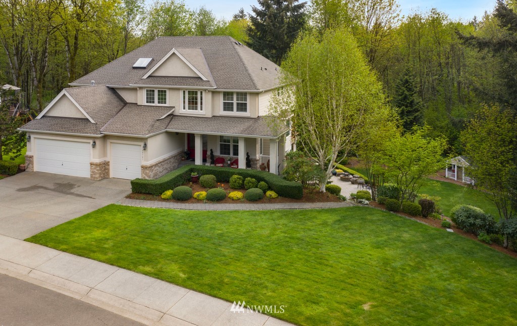 20707 Southeast 162nd Way Renton, WA 98059 - Photo 1 of 1 a view of a big house with a big yard and large trees