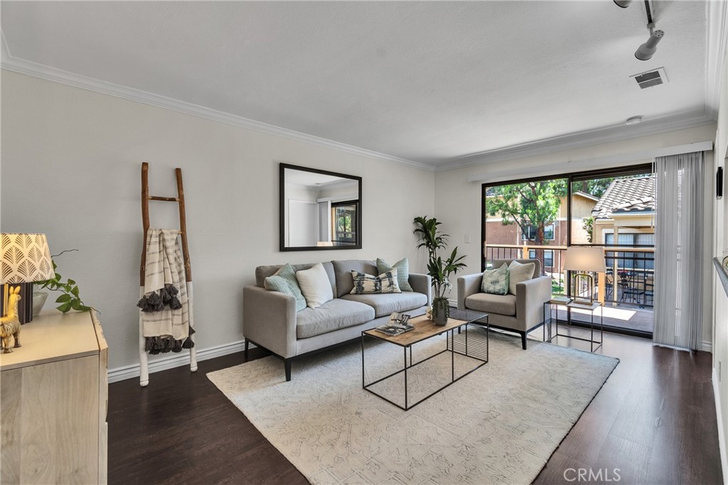 10655 Lemon Avenue, Unit 3002 Rancho Cucamonga, CA 91737 - Photo 1 of 1 a living room with furniture and a large window